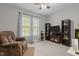 Comfortable living room with plush recliner, ceiling fan, and media center at 105 Oak Ridge Rd, Franklinton, NC 27525