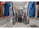Bright walk-in closet with hanging racks, shelving, and storage containers at 105 Oak Ridge Rd, Franklinton, NC 27525