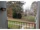 Scenic view from the balcony of lush landscaping and distant buildings, offering peaceful outdoor retreat at 108 Ephesus Church Rd # Apt 416, Chapel Hill, NC 27517