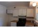 Functional kitchen featuring white cabinets, wood-look countertops, and modern appliances for meal preparation at 108 Ephesus Church Rd # Apt 416, Chapel Hill, NC 27517