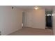 An inviting living room featuring neutral carpet and paint, with views into the kitchen area at 108 Ephesus Church Rd # Apt 416, Chapel Hill, NC 27517