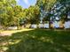 Enjoy the spacious backyard with mature trees and a privacy fence; a perfect outdoor escape at 1106 Purple Glory Dr, Apex, NC 27502