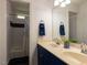 This bathroom boasts a double sink vanity, large mirror, and shower/tub combo with neutral finishes at 1106 Purple Glory Dr, Apex, NC 27502