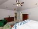 Well-lit bedroom with dressers, and a view into an adjoining room at 1106 Purple Glory Dr, Apex, NC 27502