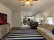 Open-concept living space with seamless flow between living room and kitchen at 1106 Purple Glory Dr, Apex, NC 27502