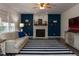 Cozy living room with brick fireplace, modern furniture, and stylish decor at 1106 Purple Glory Dr, Apex, NC 27502