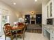 Open floor plan with dining area leading to spacious living room with fireplace at 1106 Purple Glory Dr, Apex, NC 27502