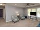 Cozy living room with a ceiling fan, comfortable seating, and natural light at 1106 Purple Glory Dr, Apex, NC 27502