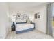 Bedroom showcasing a comfortable daybed with blue bedding and decorative accents at 1112 Landen Creek Ln, Zebulon, NC 27597