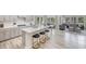 Modern kitchen featuring a center island with seating, stainless steel appliances, and an open floorplan at 1112 Landen Creek Ln, Zebulon, NC 27597