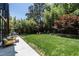 Lush backyard with mature trees, sprawling lawn, and a serene ambiance at 117 Hillcrest Rd, Raleigh, NC 27605