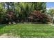 Picturesque backyard with a manicured lawn, mature plantings, and a tranquil atmosphere at 117 Hillcrest Rd, Raleigh, NC 27605