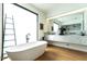 Modern bathroom features a soaking tub, sleek fixtures, and luxurious marble countertop at 117 Hillcrest Rd, Raleigh, NC 27605