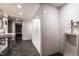 Bright bathroom featuring tiled shower, modern fixtures, white vanity, and urinal at 117 Hillcrest Rd, Raleigh, NC 27605
