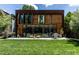 Stunning home with a modern facade, large windows, and beautifully landscaped backyard at 117 Hillcrest Rd, Raleigh, NC 27605