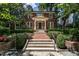 Beautiful brick home with a manicured lawn and a welcoming front entrance with mature trees at 117 Hillcrest Rd, Raleigh, NC 27605