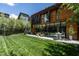 Modern home with expansive windows, sleek design, and a well-maintained backyard at 117 Hillcrest Rd, Raleigh, NC 27605