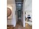 Hallway features metal staircase, modern artwork and transitions into the living room at 117 Hillcrest Rd, Raleigh, NC 27605