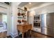 Well-equipped kitchen with stainless steel appliances, custom cabinets, and butcher block island at 117 Hillcrest Rd, Raleigh, NC 27605
