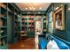 Cozy library featuring custom built-in bookshelves, a comfortable sofa, and elegant decor at 117 Hillcrest Rd, Raleigh, NC 27605