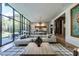 Open-concept living area with gourmet kitchen, spacious living room and large windows at 117 Hillcrest Rd, Raleigh, NC 27605