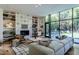Stylish living room boasting built-in shelving, oversized windows and modern décor at 117 Hillcrest Rd, Raleigh, NC 27605