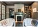 Sophisticated living room featuring a cozy fireplace, elegant seating, and classic architectural details at 117 Hillcrest Rd, Raleigh, NC 27605