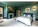 Green main bedroom boasting a fireplace, soft carpet, and abundant natural light at 117 Hillcrest Rd, Raleigh, NC 27605