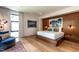 Modern main bedroom features wood-paneled accent wall, platform bed, and large windows at 117 Hillcrest Rd, Raleigh, NC 27605