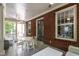 Charming covered patio features brick walls and a cozy seating area, perfect for relaxation at 117 Hillcrest Rd, Raleigh, NC 27605