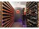 Luxurious wine cellar featuring extensive wooden wine racks and neon lighting at 117 Hillcrest Rd, Raleigh, NC 27605