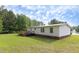 Large lot with ample backyard space, wheelchair ramp access and well-maintained lawn at 1201 Red Sunset Pl, Siler City, NC 27344