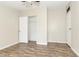 Neutral bedroom offers a ceiling fan, closet, and vinyl wood flooring at 1201 Red Sunset Pl, Siler City, NC 27344