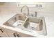 Close-up highlighting the kitchen's modern sink, faucet, and countertop details by the window at 1201 Red Sunset Pl, Siler City, NC 27344