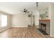 Comfortable living room with a decorative fireplace and easy access to other rooms at 1201 Red Sunset Pl, Siler City, NC 27344