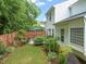 Landscaped backyard with green lawn and a patio featuring a seating area at 1408 Fairmont St, Durham, NC 27713