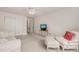 Cozy bedroom with double closets and a comfortable seating arrangement, including a TV at 1408 Fairmont St, Durham, NC 27713