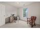 Bright bedroom featuring a desk, chair, and a view from the window at 1408 Fairmont St, Durham, NC 27713