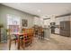 An open layout Kitchen with wood table and chairs at 1408 Fairmont St, Durham, NC 27713