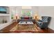 Bright living room with lots of natural light, a comfortable sofa and elegant decor throughout at 1408 Fairmont St, Durham, NC 27713