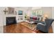 Cozy living room features a fireplace, large windows, and comfortable seating at 1408 Fairmont St, Durham, NC 27713