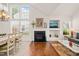 Inviting living room with a fireplace, built-in shelving, and a dining area for Gathering meals at 1408 Fairmont St, Durham, NC 27713