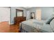 Main Bedroom featuring an ensuite bathroom, large mirror, and hardwood floors at 1408 Fairmont St, Durham, NC 27713