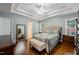 Main Bedroom featuring a tray ceiling, hardwood floors, and ensuite bathroom at 1408 Fairmont St, Durham, NC 27713