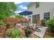 Outdoor patio featuring a table with seating and landscaped yard at 1408 Fairmont St, Durham, NC 27713