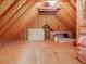 Unfinished attic has a wood floor, exposed wood beams, and insulation in the walls at 1428 Gray Bluff Trl, Chapel Hill, NC 27517