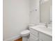 Powder room with white vanity, chrome faucet, and sleek mirror at 1428 Gray Bluff Trl, Chapel Hill, NC 27517