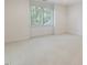 Bedroom with white walls and carpet plus a large window at 1428 Gray Bluff Trl, Chapel Hill, NC 27517