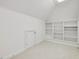 Bright bedroom features neutral carpet, white walls, skylight, and built-in shelves at 1428 Gray Bluff Trl, Chapel Hill, NC 27517