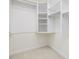 Walk-in closet features built-in shelving and clothing rods at 1428 Gray Bluff Trl, Chapel Hill, NC 27517